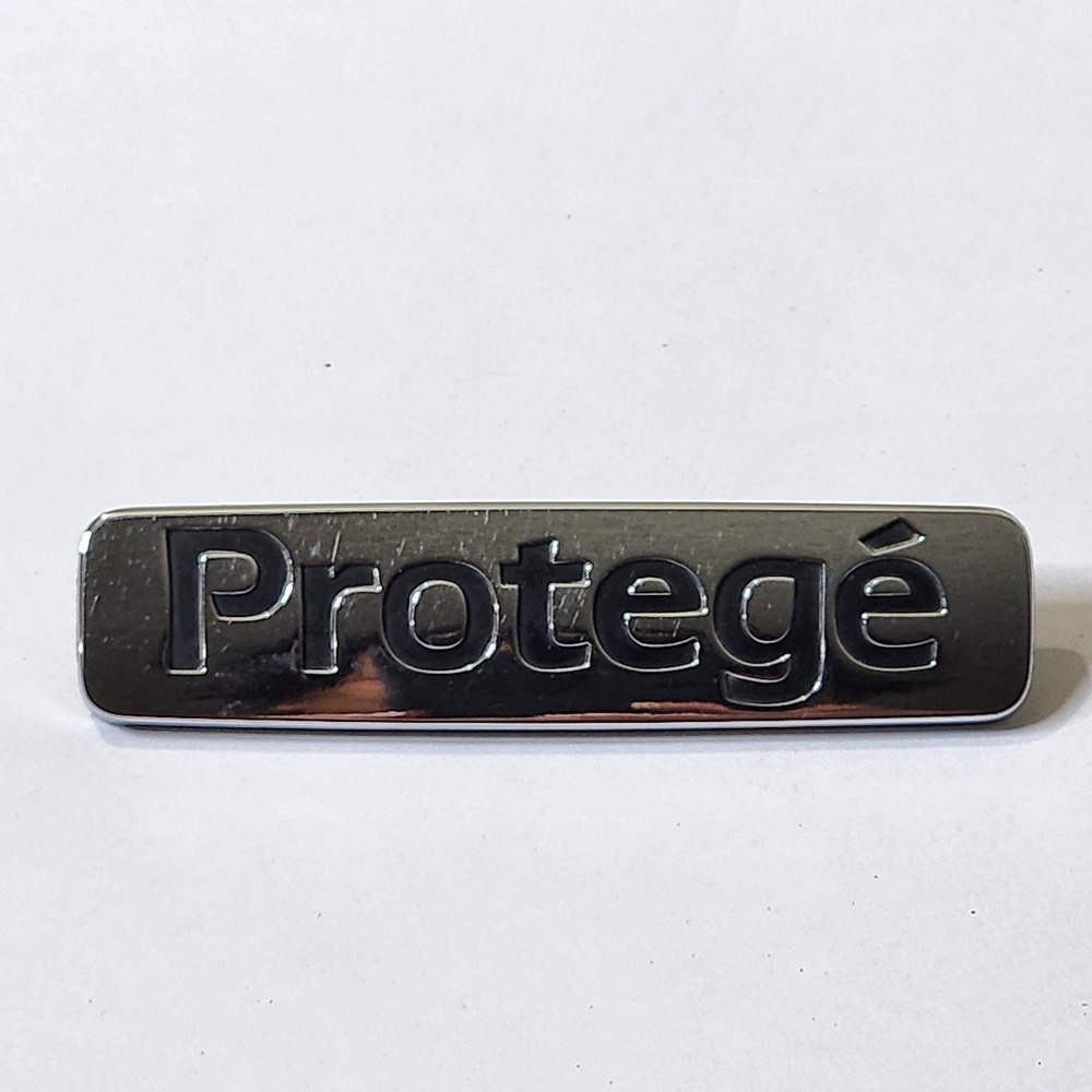 OEM Factory Genuine Stock Mazda Protege Chrome trunk emblem badge decal Logo